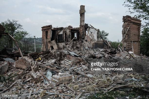 The remains of a destroyed school in which Ukrainian official say 60 people sheltering in a basement died following a Russian military strike on the...