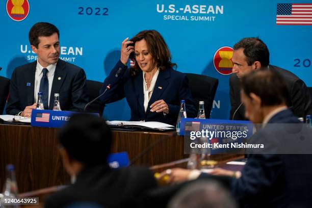 Vice President Kamala Harris, flanked by Secretary of Transportation Pete Buttigieg and Deputy National Security Advisor to the Vice President Philip...