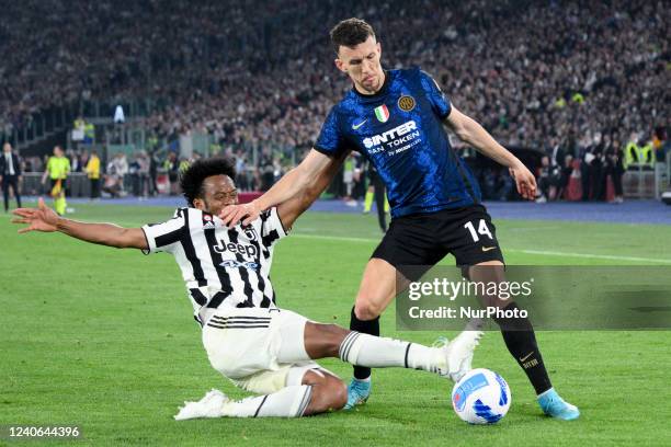 Juan Cuadrado of FC Juventus and Ivan Perisic of FC Internazionale competes for the ball during the Coppa Italian Final match between Juventus FC and...