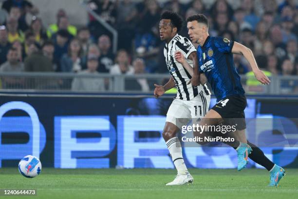 Ivan Perisic of FC Internazionale and Juan Cuadrado of FC Juventus competes for the ball during the Coppa Italian Final match between Juventus FC and...