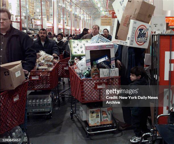 December 23: Buyers at various Queens stores were shopping because of the Y2K scare. Most say they weren't worried but not taking chances. These...