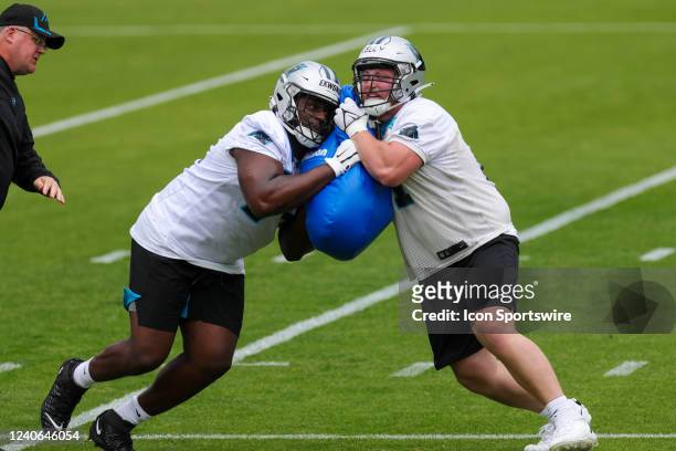 Carolina Panthers Tackle Ikem Ekwonu and Offensive Line Hunter Kelly conduct drills during day one of the Rookie Mini Camp on May 13, 2022 at the...