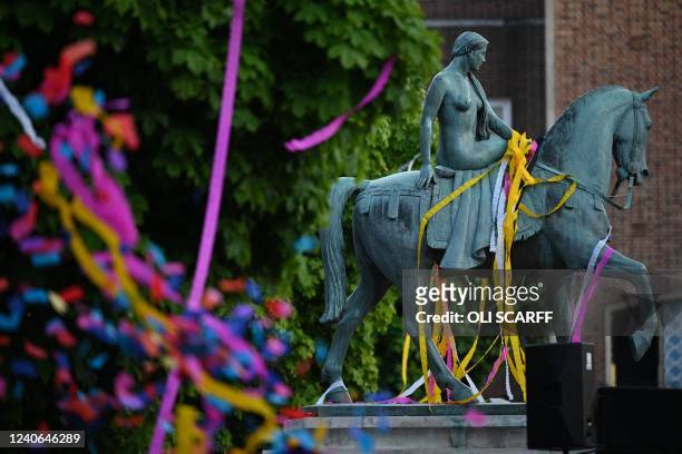 The statue of Lady Godiva is covered in confetti which was dispersed as performers with the French acrobatics company Gratte Ciel concluded the world...