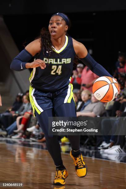 Arike Ogunbowale of the Dallas Wings dribbles the ball during the game against the Washington Mystics on May 13, 2022 at Entertainment and Sports...