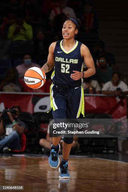 Tyasha Harris of the Dallas Wings dribbles the ball during the game against the Washington Mystics on May 13, 2022 at Entertainment and Sports Arena...