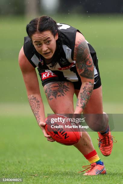 Demi Hallett of the Magpies gathers the loose ball during the round 12 VFLW match between the Collingwood Magpies and the Western Bulldogs at AIA...