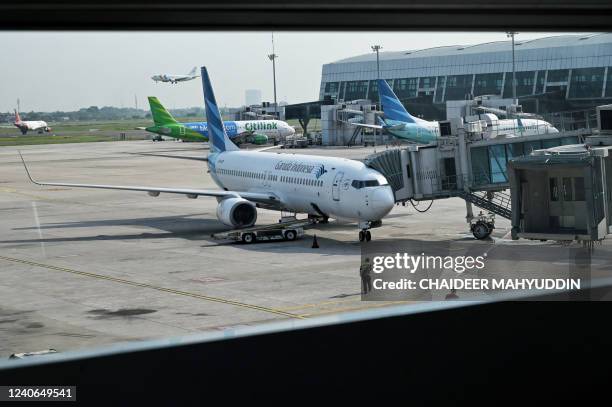 The picture show a Garuda Indonesia plane parked at Soekarno Hatta international airport in Tangerang on May 14, 2022.