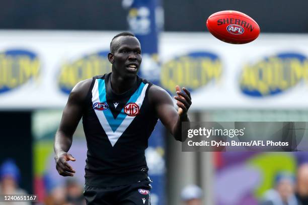 Aliir Aliir of the Power in action during the 2022 AFL Round 09 match between the North Melbourne Kangaroos and the Port Adelaide Power at Blundstone...