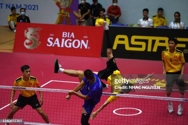 Vietnam's Nguyen Van Ly kicks a shot in the sepaktakraw match against Thailand during the 31st Southeast Asian Games in Hanoi on May 14, 2022.