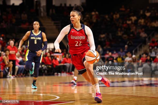 May 13: Alysha Clark of the Washington Mystics drives to the basket against the Dallas Wings during the first half of the WNBA game at Entertainment...