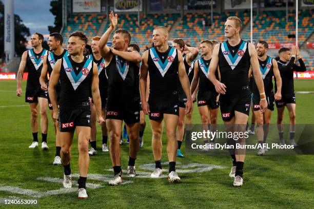Port Adelaide celebrate during the 2022 AFL Round 09 match between the North Melbourne Kangaroos and the Port Adelaide Power at Blundstone Arena on...