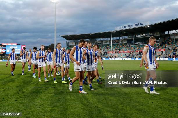 North Melbourne leave the field after a loss during the 2022 AFL Round 09 match between the North Melbourne Kangaroos and the Port Adelaide Power at...