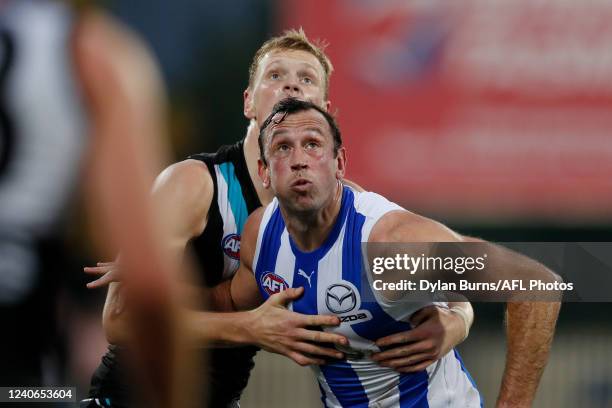 Sam Hayes of the Power and Todd Goldstein of the Kangaroos compete for the ball during the 2022 AFL Round 09 match between the North Melbourne...
