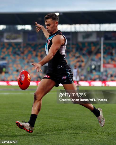 Karl Amon of the Power kicks the ball during the 2022 AFL Round 09 match between the North Melbourne Kangaroos and the Port Adelaide Power at...