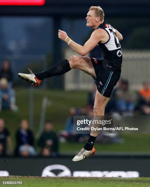 Sam Hayes of the Power kicks the ball during the 2022 AFL Round 09 match between the North Melbourne Kangaroos and the Port Adelaide Power at...