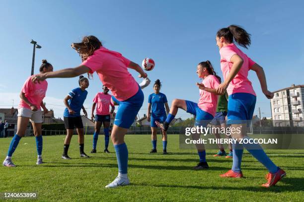 Yzeure's football players take part in a training session at Yzeure, central France on May 11, 2022. - A real class struggle: the first D2 club to...