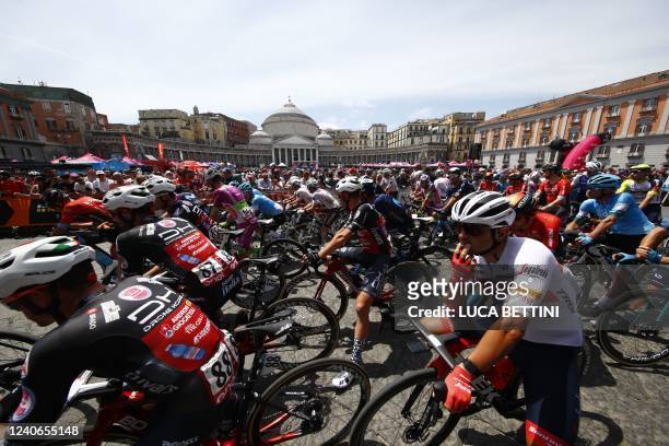 Riders prepare to take the start of the 8th stage of the Giro d'Italia 2022 cycling race from Piazza del Plebiscito in Naples, 153 kilometers between...