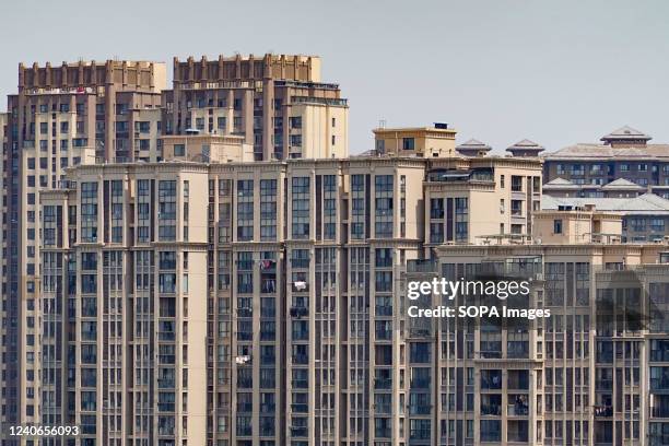 Some of the Chinese residential buildings stand in Changzhou. China's property industry, worth 10 trillion yuan and involving scores of subsectors...