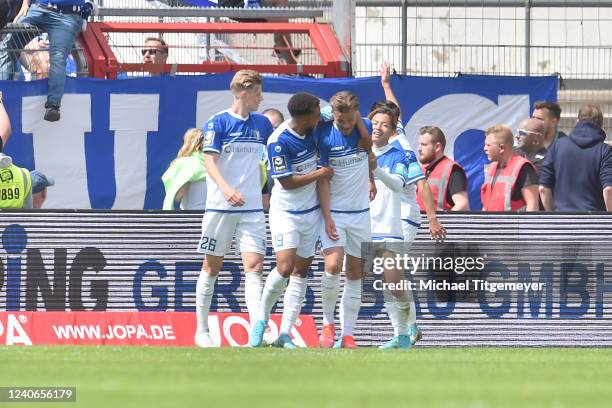 Henry Rorig of Magdeburg celebrates with teammates after scoring his team's goal during the 3. Liga match between VfL Osnabrück and 1. FC Magdeburg...