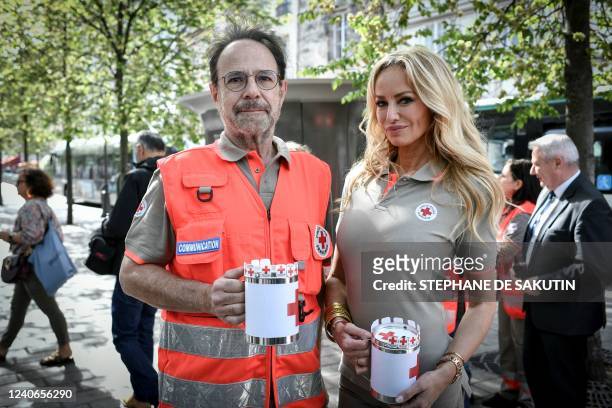 Red Cross "Croix-Rouge" Ambassadors, French writer Marc Levy and Slovak model Adriana Karembeu pose during the launch of the Croix Rouge national...