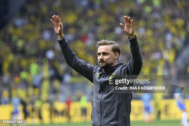 Dortmund's German defender Marcel Schmelzer reacts after his farewell before the German first division Bundesliga football match Borussia Dortmund v...