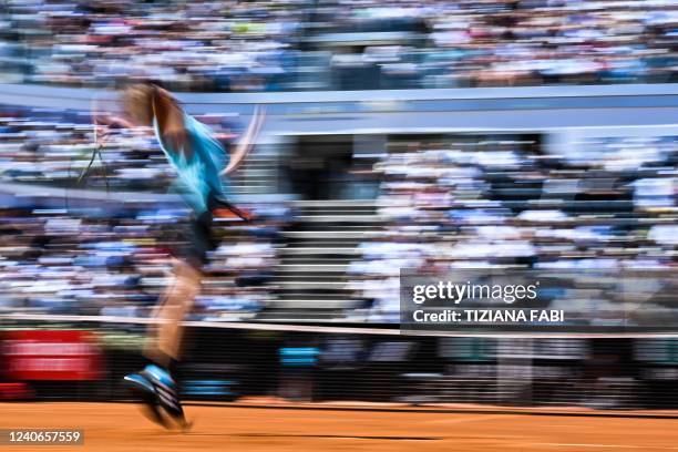 Germany's Alexander Zverev serves to Greece's Stefanos Tsitsipas during their semifinal match at the ATP Rome Open tennis tournament on May 14, 2022...