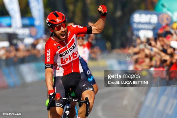 Team Lotto's Belgian rider Thomas De Gendt celebrates as he crosses the finish line to win the 8th stage of the Giro d'Italia 2022, 153 kilometers...