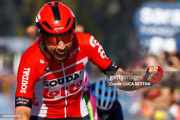 Team Lotto's Belgian rider Thomas De Gendt celebrates as he crosses the finish line to win the 8th stage of the Giro d'Italia 2022, 153 kilometers...