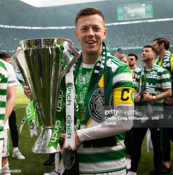 Celtics Callum McGregor celebrates with the cinch Premiership Trophy during a cinch Premiership match between Celtic and Motherwell at Celtic Park,...