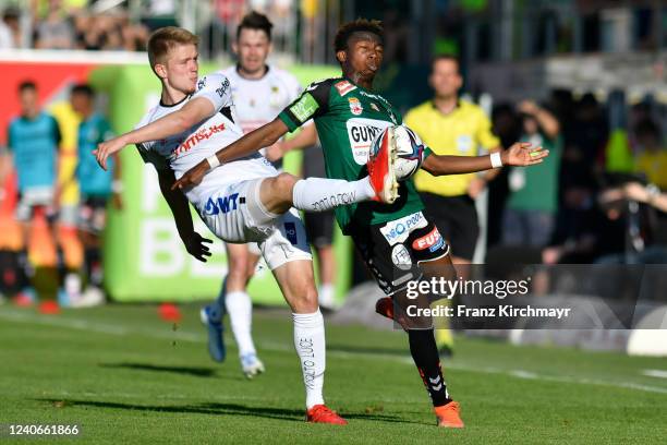 Jan Boller of LASK and Dorgeles Nene of Ried during the Admiral Bundesliga match between SV Ried and LASK at josko ARENA on May 14, 2022 in Ried,...