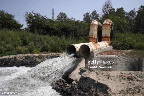 Sewage drain with chemical foam from industrial effluents finds its way into the revered Yamuna river, in New Delhi, India on May 14, 2022. The...