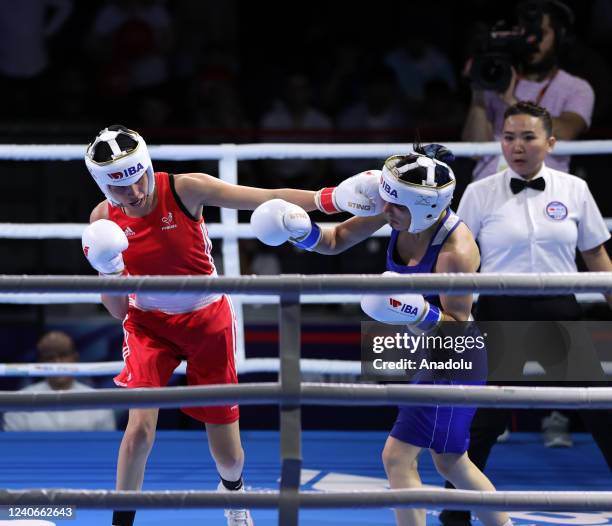 Ayse Cagirir of Turkiye competes with Rim Bennama of France during women's 48 kg match on the sixth day of the International Boxing Association...