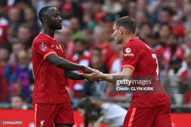 Liverpool's Guinean midfielder Naby Keita and Liverpool's English midfielder James Milner react during the English FA Cup final football match...