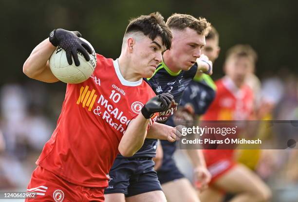 Leitrim , Ireland - 14 May 2022; Conor Cush of Tyrone in action against Dean O'Donoghue of Kildare during the EirGrid GAA Football All-Ireland Under...