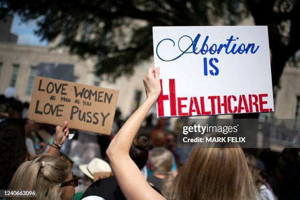 Demonstrators gather outside the Houston, Texas, City Hall during a Bans Off Our Bodies rally on May 14, 2022. - Thousands of activists are...