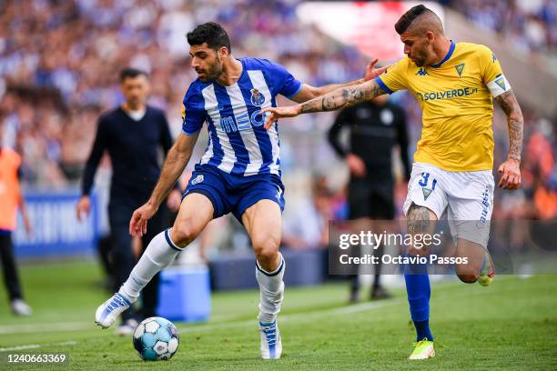 Mehdi Taremi of FC Porto and Joãozinho of Estoril Praia in action during the Liga Portugal Bwin match between FC Porto and GD Estoril Praia at...