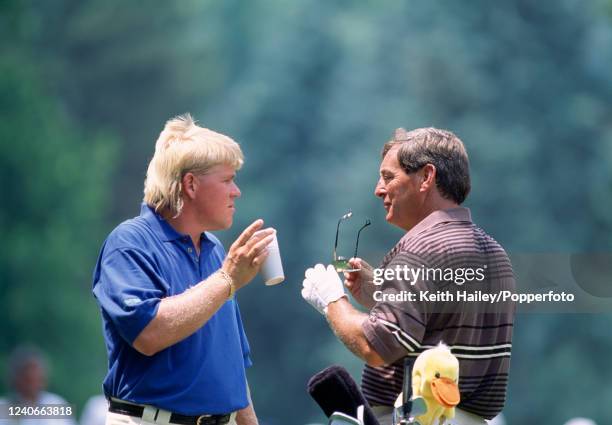 John Daly of the United States in conversation with Fuzzy Zoeller during the first round of the US Open Golf Championship at Baltusrol Golf Club on...