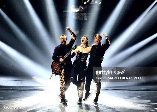 Members of the band "We Are Domi", Benjamin Rekstad, Casper Hatlestad and Dominika Haskova react after performing on behalf of the Czech Republic...