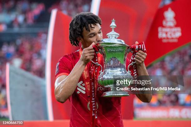 Trent Alexander-Arnold of Liverpool celebrates and kiss a trophy during The FA Cup Final match between Chelsea and Liverpool at Wembley Stadium on...