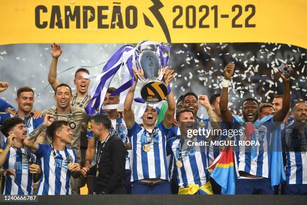 Porto's players celebrate with the Primeira Liga trophy after winning the Portuguese league football match between FC Porto and GD Estoril Praia at...