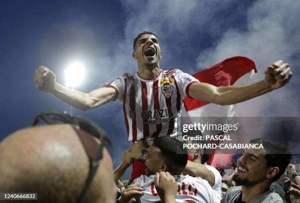Ajaccio's French Forward Mounaim El Idrissy celebrates after winning the last L2 football match of the 2022 season between Ajaccio and Toulouse at...