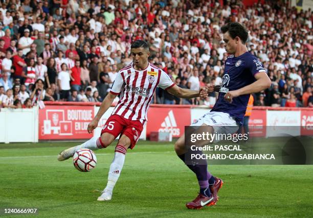 Ajaccio's French midfielder Riad Nouri fights for the ball with Toulouse's Danish defender Rasmus Nicolaisen during the last L2 football match for...