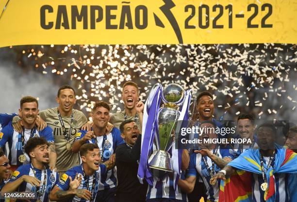 Porto's players celebrate with the Primeira Liga trophy after winning the Portuguese league football match between FC Porto and GD Estoril Praia at...