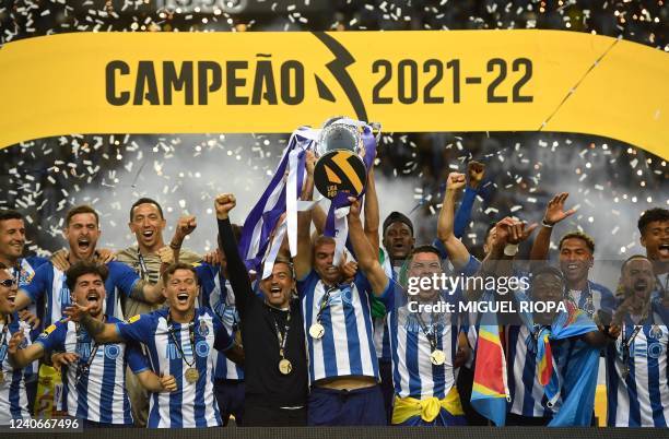 Porto's players celebrate with the Primeira Liga trophy after winning the Portuguese league football match between FC Porto and GD Estoril Praia at...