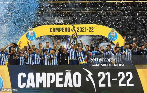 Porto's players celebrate with the Primeira Liga trophy after winning the Portuguese league football match between FC Porto and GD Estoril Praia at...