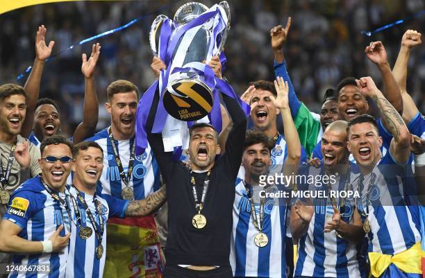 Porto's Portuguese coach Sergio Conceicao and his players celebrate with the Primeira Liga trophy after winning the Portuguese league football match...