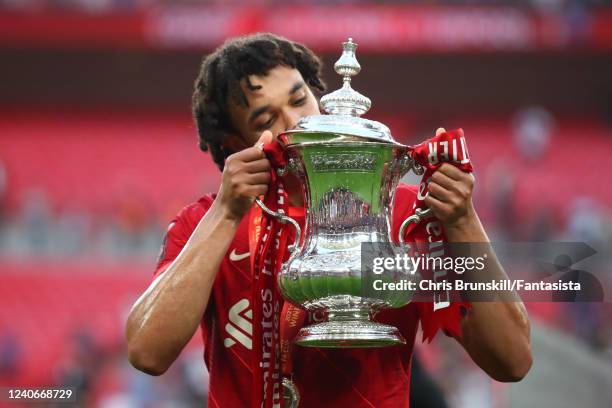 Trent Alexander-Arnold of Liverpool kisses the trophy following his sides victory in a penalty shootout during The FA Cup Final match between Chelsea...