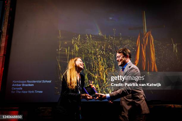 Prince Constantijn of The Netherlands with World Press Photo of the Year winner Amber Bracken from Canada with her winning photo "Kamloops...