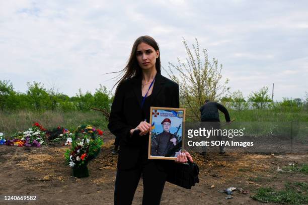 Cousin of a dead soldier, Sergey Titov, 32 years old, sergeant of the National Guard shows his portrait. Russia invaded Ukraine on 24 February 2022,...