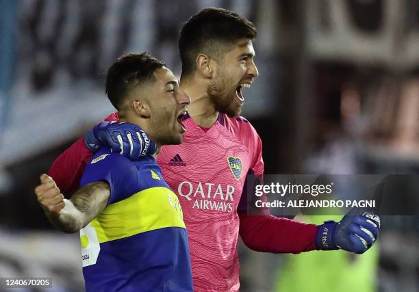 Boca Juniors' midfielder Alan Varela celebrates with goalkeeper Agustin Rossi after scoring the winning penalty during the shoot-out against Racing...